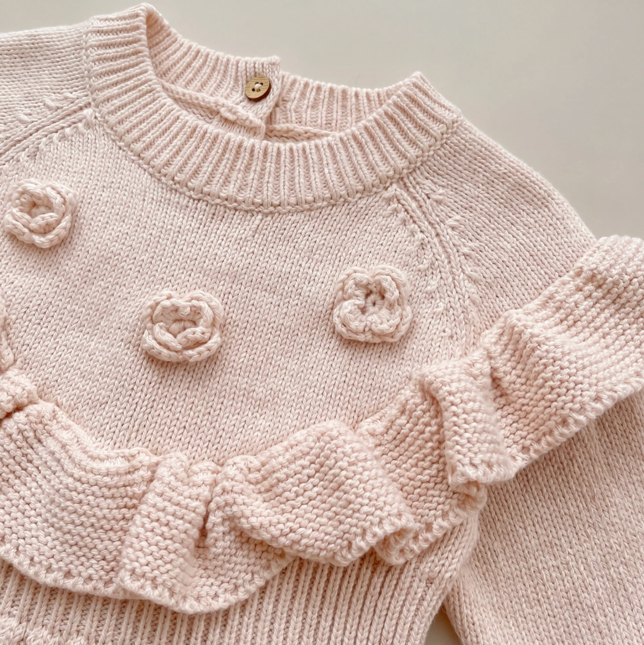 The Rosette Ruffle Romper